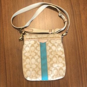Tan Coach crossbody with teal accent